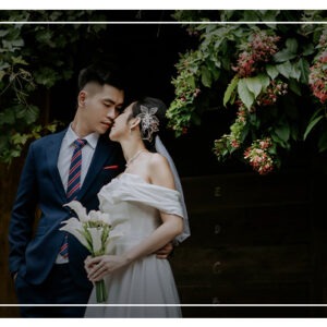 Asian couple on wedding day , looking gracefully at one another on their wedding day