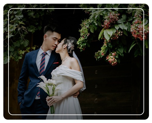 Asian couple on wedding day , looking gracefully at one another on their wedding day