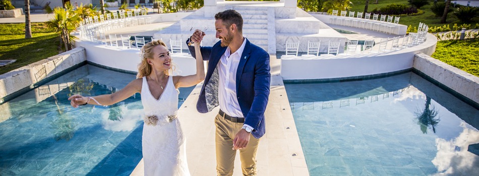 Destination wedding couple smiling together . Photo Credit 