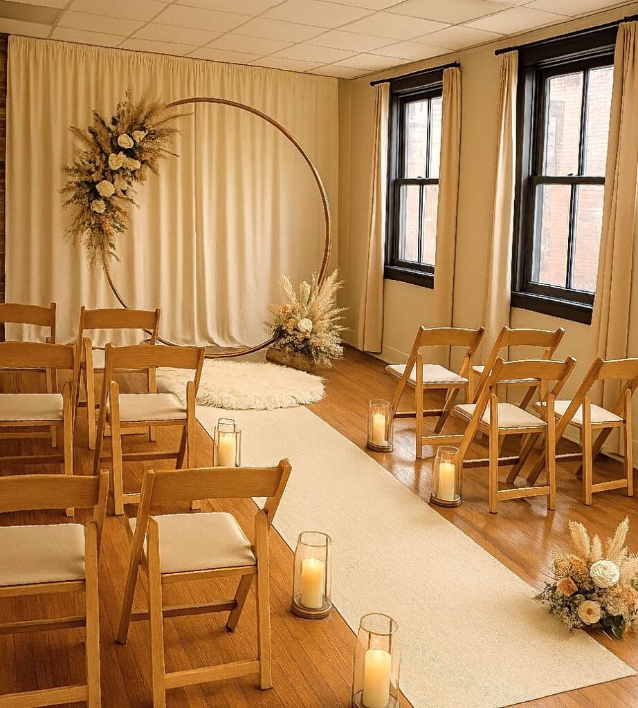 Union NJ Luxury Micro Wedding Set up for 10. Circular backdrop with brown wooden chairs. soft white carpet and white carpet and LED lights